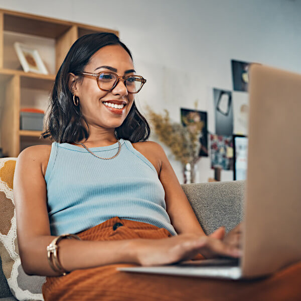 Woman browsing the web and search results on her laptop.